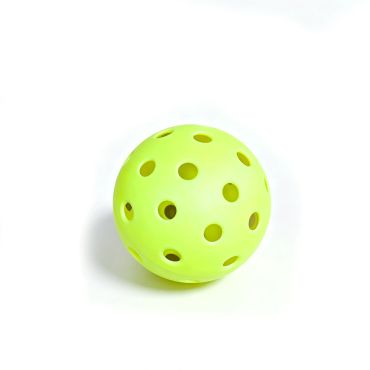 Green perforated plastic ball on a white background.