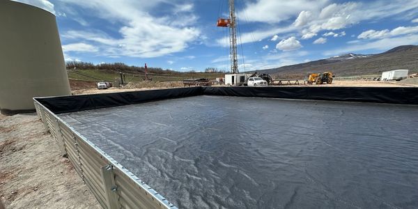 Oil/Gas pad containment to prevent leakage from tanks spilling into the environment. Collbran, Co