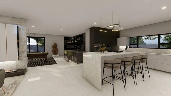 Modern open kitchen with marble island and stylish bar stools.