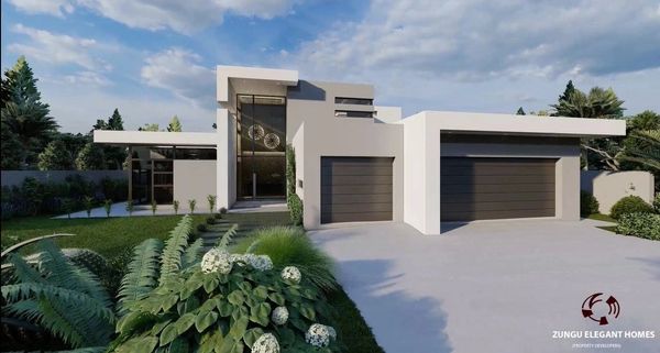 Modern white house with large glass entrance and three-car garage.