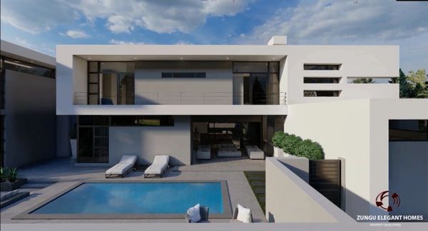 Modern two-story home with outdoor pool and lounge chairs under a blue sky.