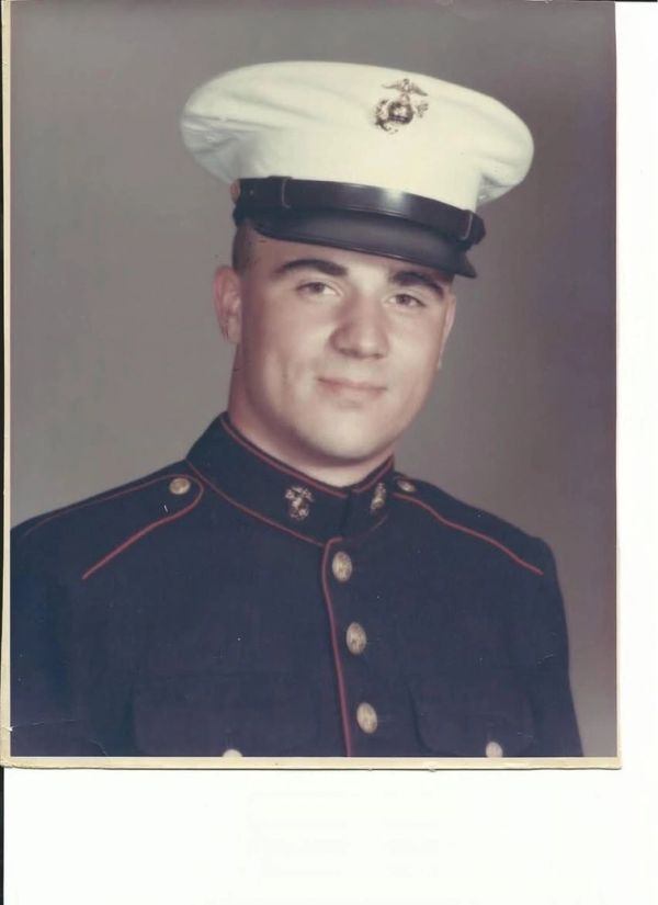 Young Marine in dress uniform.