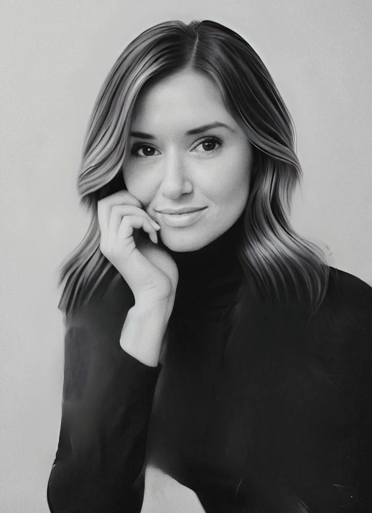 Black and white portrait of a woman with soft waves and a thoughtful expression.