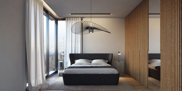 Modern bedroom with large windows and wooden accents.
