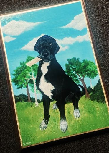 Painting of a black and white dog holding a bone in a green field under a blue sky.
