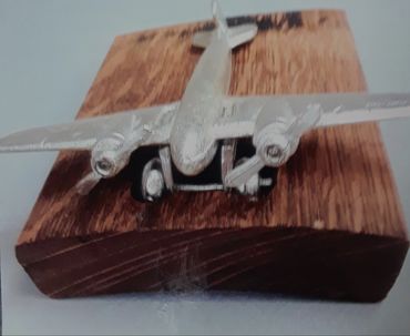 US Army NZ 4107-B lead cast plane on bourbon barrel stave.  $200.00