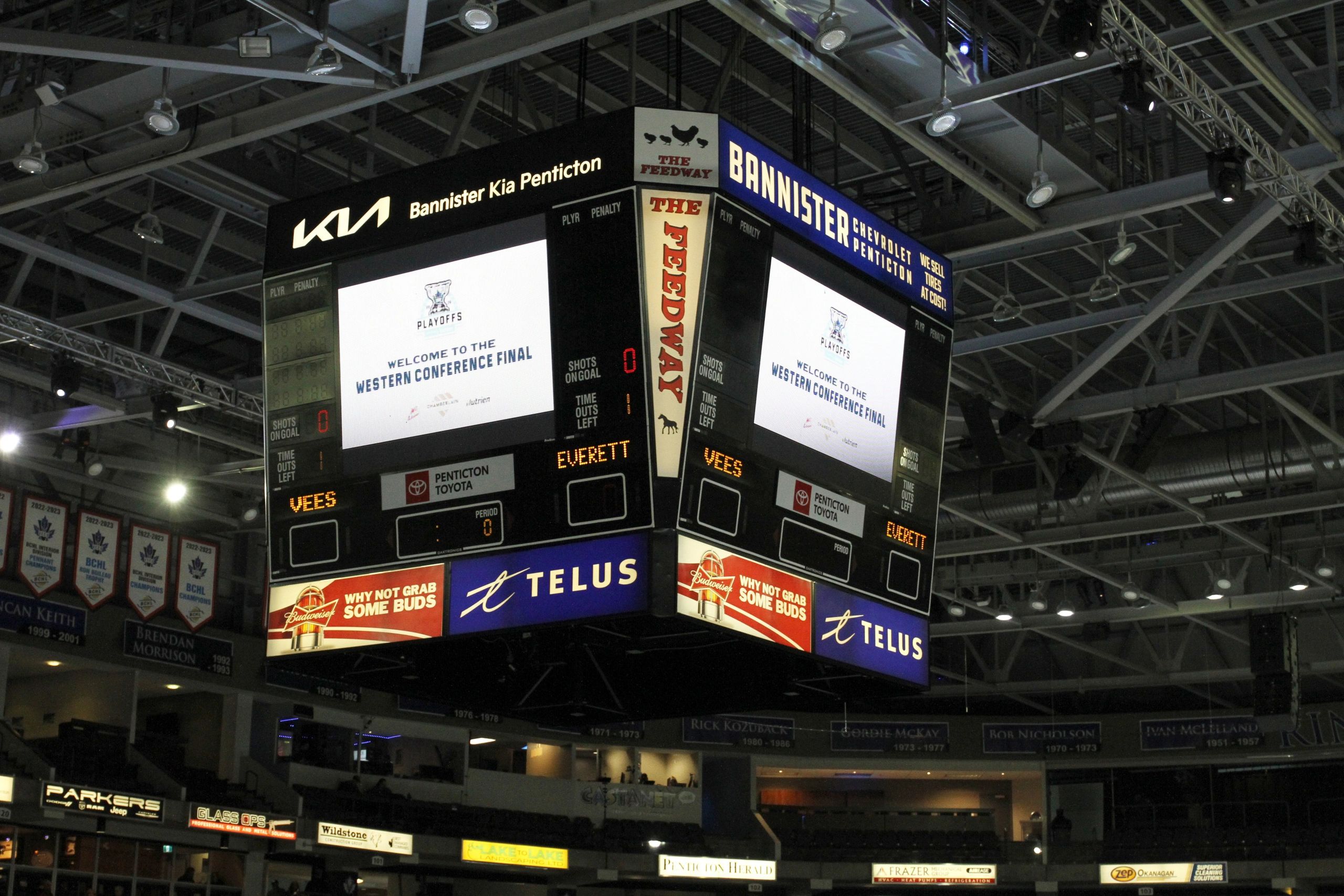 Hockey arena scoreboard displays Western Conference Final playoff information.