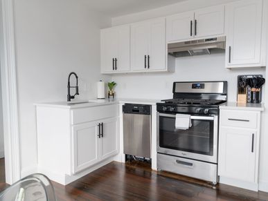 A studio kitchen with stainless steel appliances