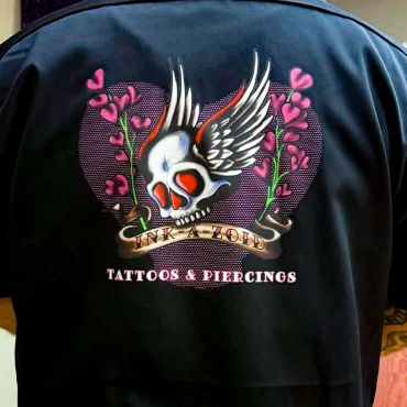 Skull with wings and hearts design on jacket back.