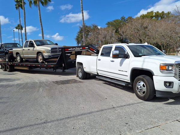 pickup towing two cars
