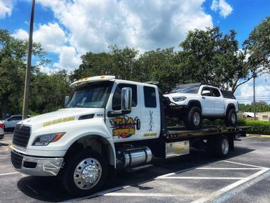 tow truck towing a pickup