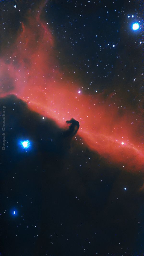 Horsehead Nebula with glowing stars and gas clouds.
