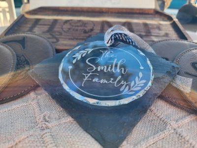 Engraved glass ornament with 'The Smith Family' text.