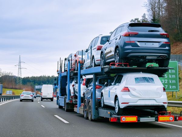 A truck transporting multiple cars