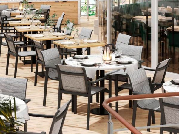 Elegant outdoor restaurant seating with modern chairs and tables.