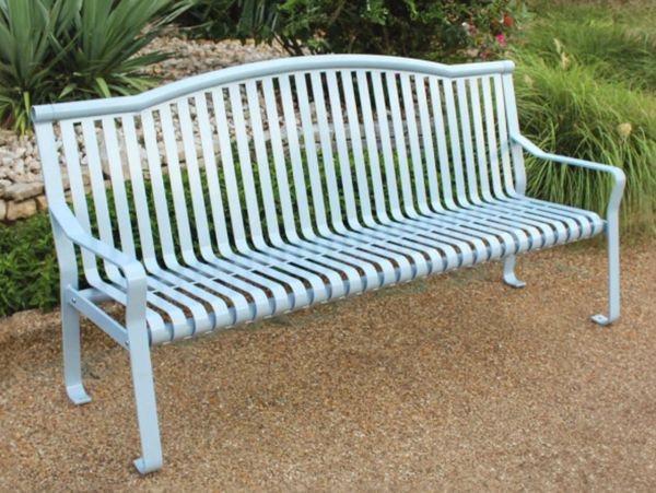 Light blue metal bench in a garden setting.