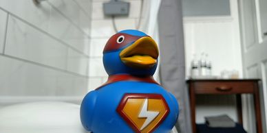 Blurry bathroom background, rubber duck in foreground