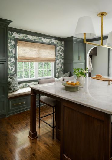 Kitchen with window bench, wallpaper and island