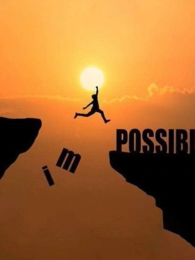 Person jumps from impossibility to possibility at sunset.