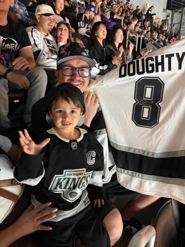Fans enjoying a Los Angeles Kings hockey game.