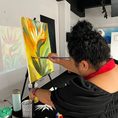 Woman painting on canvas