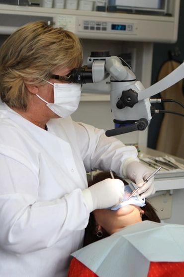 Dr. Susan Micklow performing an Endodontic exam