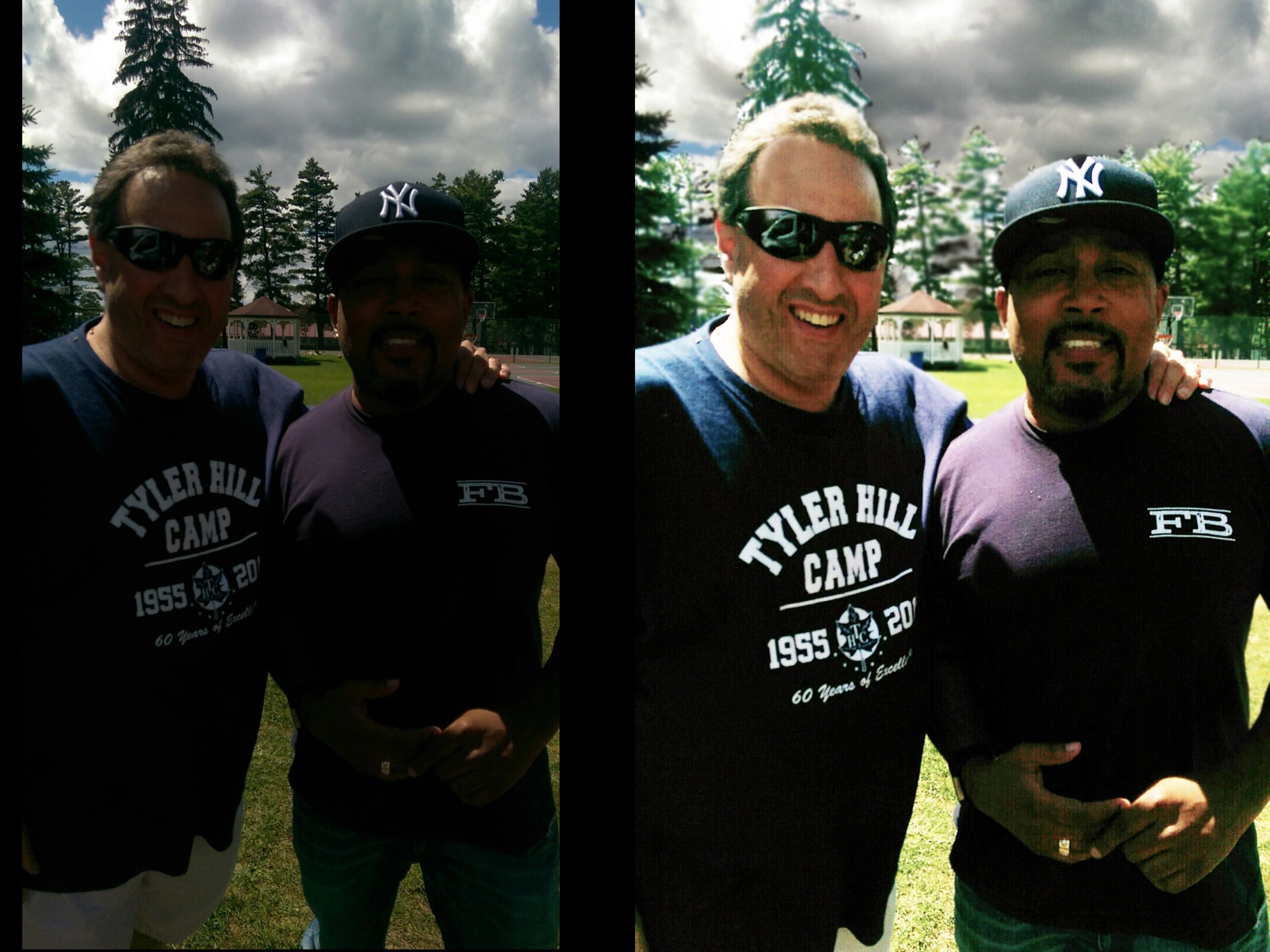 Two men posing outdoors on a sunny day, one wearing a Tyler Hill Camp shirt.