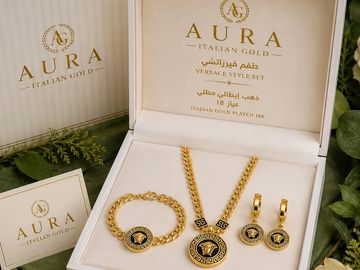 Elegant Italian gold jewelry set with necklace, bracelet, and earrings in a luxurious box.