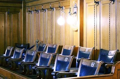 Traditional wooden jury box for a legal case construction expert witness.