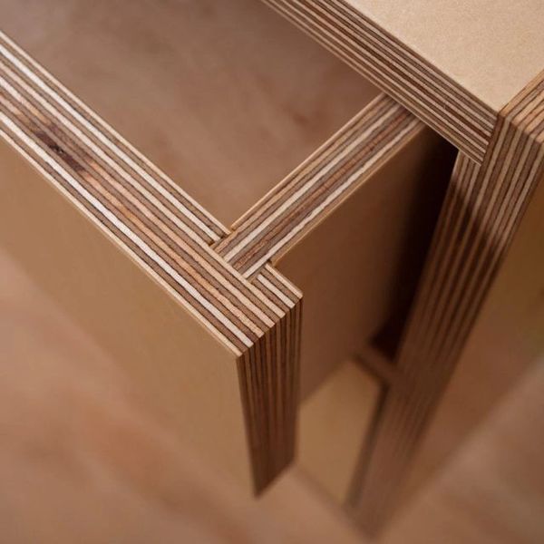 Close-up of layered plywood edges in furniture construction.