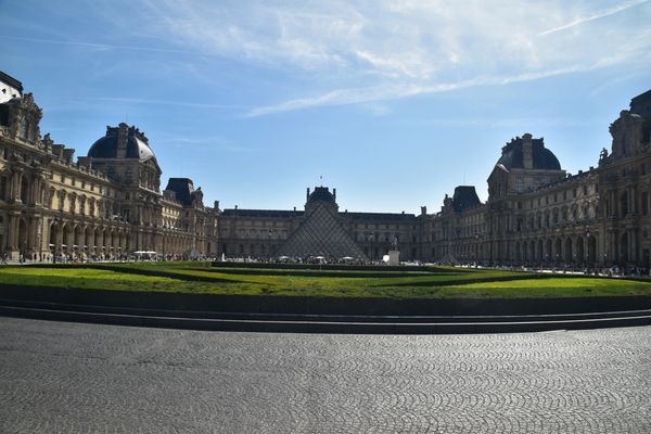 Outside the Louve - Pyramid seen in center. Paris, France