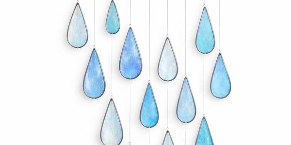 Hanging blue and white teardrop-shaped glass ornaments.
