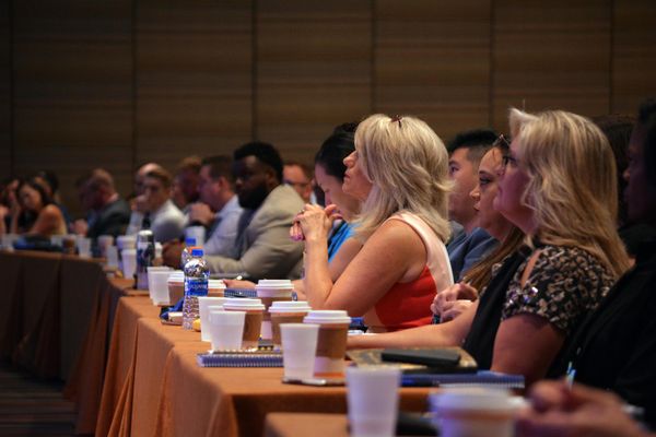 Audience attentively listening at a conference or seminar.