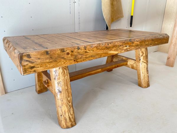 Rustic wooden bench with a polished finish.