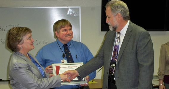 Dr. Gallagher receiving an award for gamification research at Shepphard AFB.