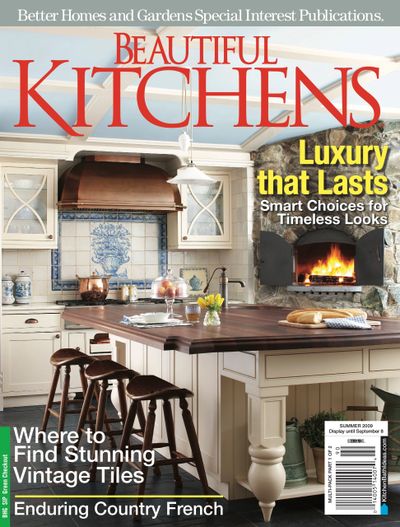 Traditional white kitchen with copper accents and beautiful wood island top