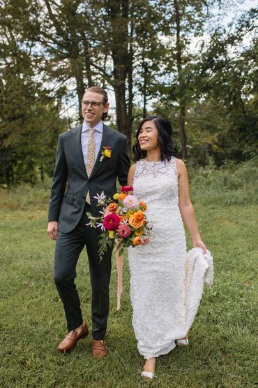 Couple on lawn at Old Mill Guest House for their summer wedding