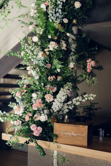 Muted pastel spring flowers adorning the bar at the Roundhouse for a spring wedding