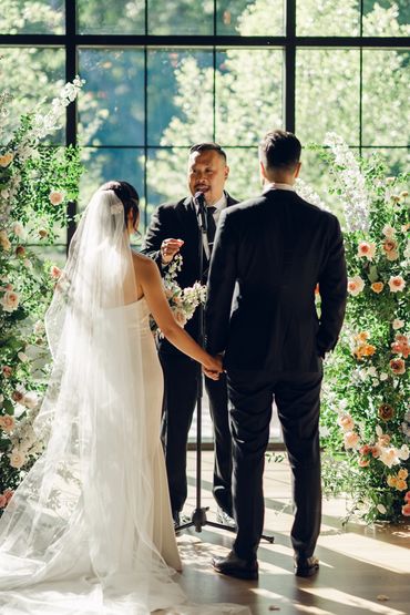 Couple getting married at an inside ceremony for their spring wedding at the Roundhouse