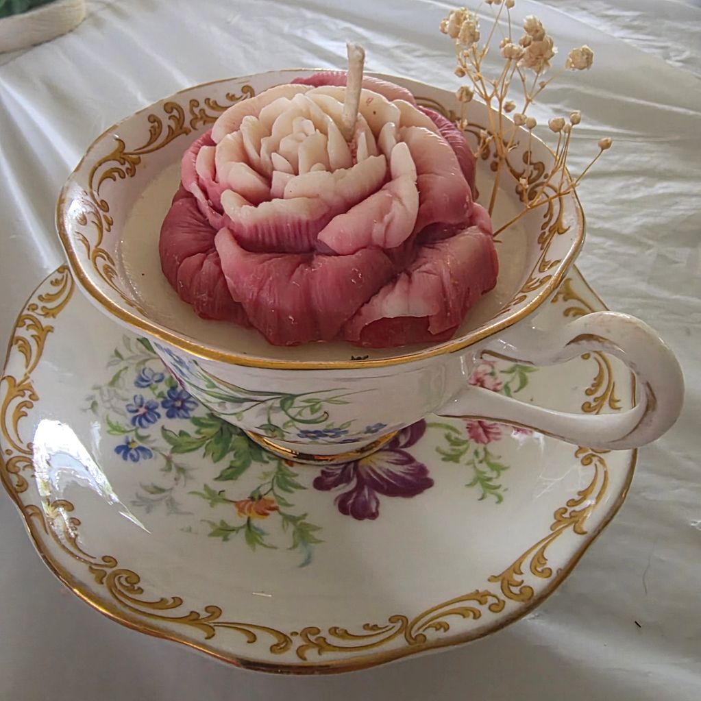 A beautifully handcrafted  soy rose candle in vintage cup