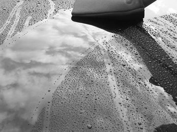 The clay bar decontamination process on the hood of a vehicle 