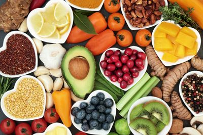 Birdseye view of fruits and vegetables presented in dishes.