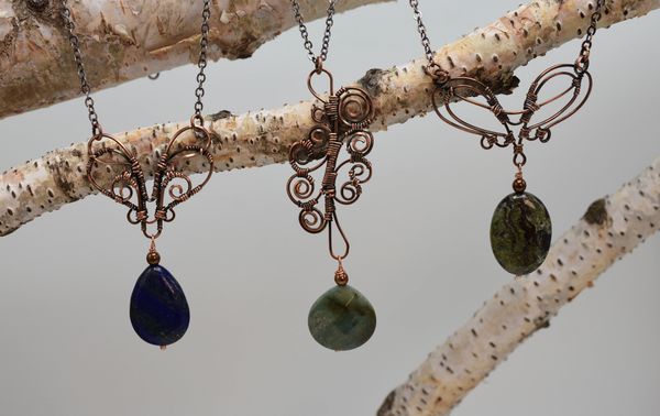 Creative hand wired artisan necklaces with semi-precious stones.
