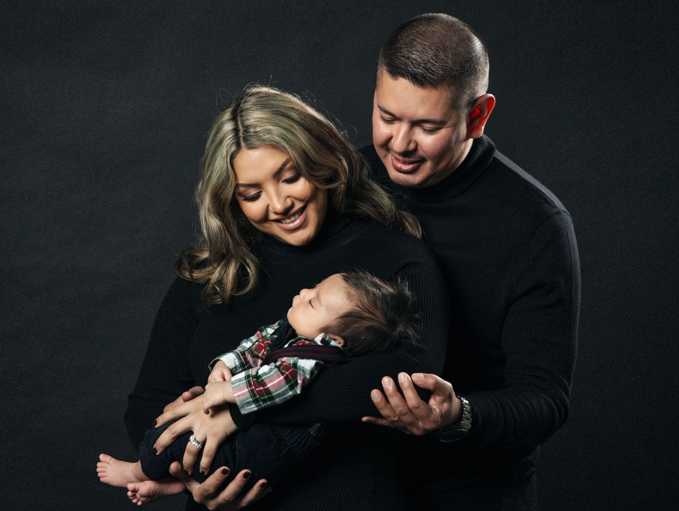 Indoor family portrait capturing loving moments of a family in Rancho Cucamonga