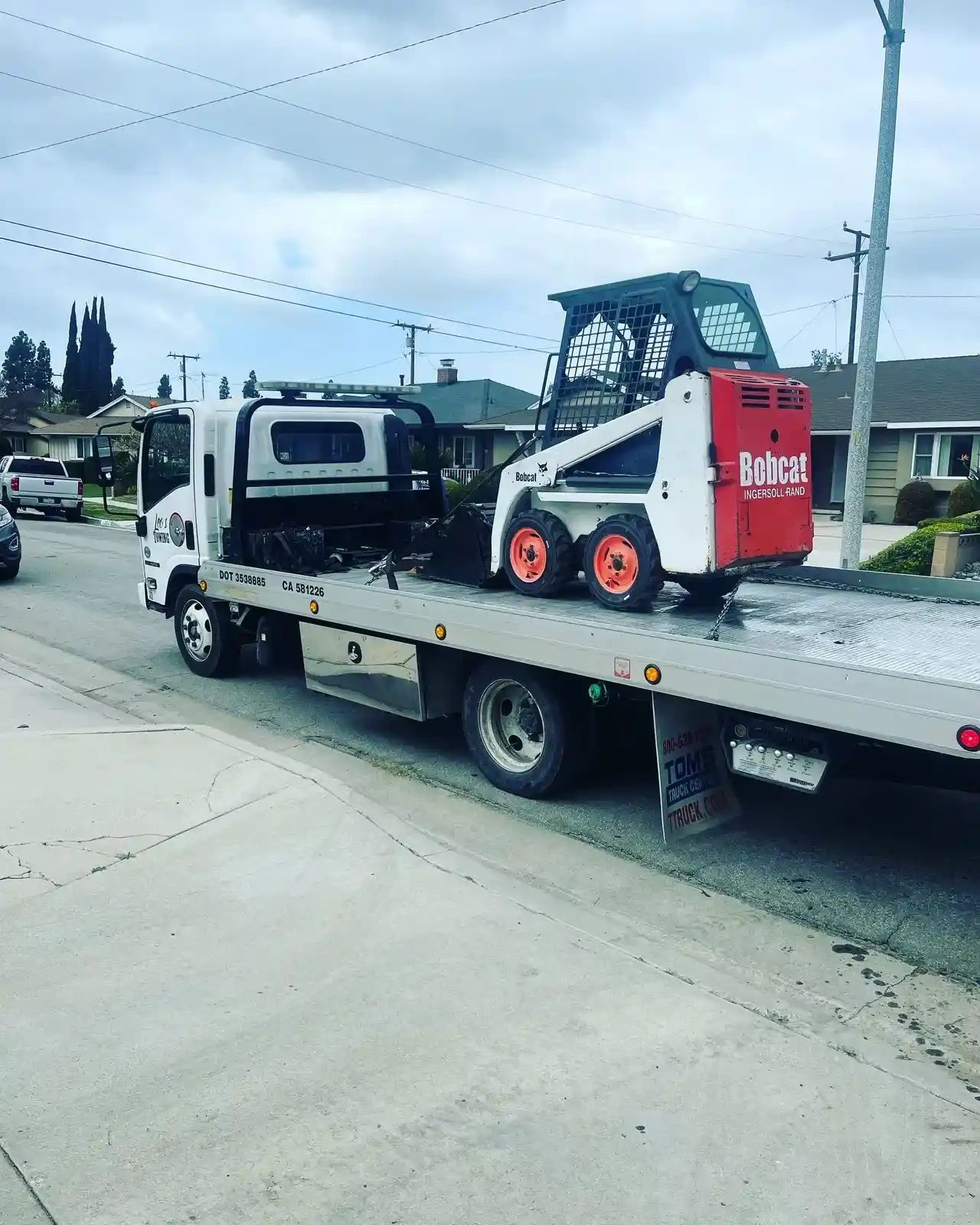 An equipment being TOWED   FROM ANAHEIM TO ANAHEIM 