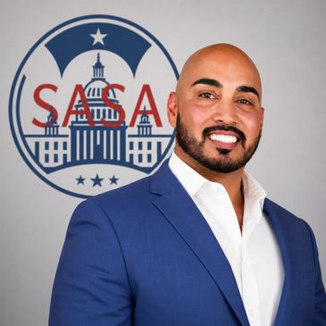 Man in blue suit smiling in front of SASAC logo.