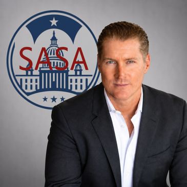 Professional man posing in front of SASA logo with Capitol building.