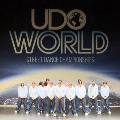 Street dance team poses on stage at UDO World Championships.