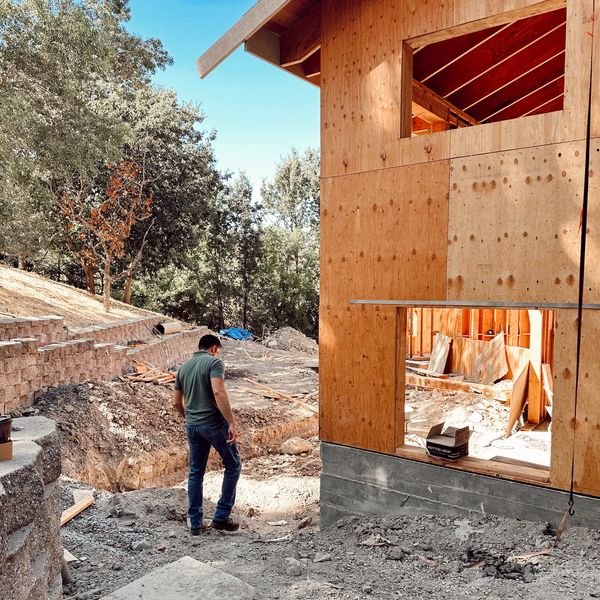 Michael walking a job site while the project is in progress, home has newly framed walls