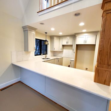 Quartz counter top with Arrow tile backsplash
